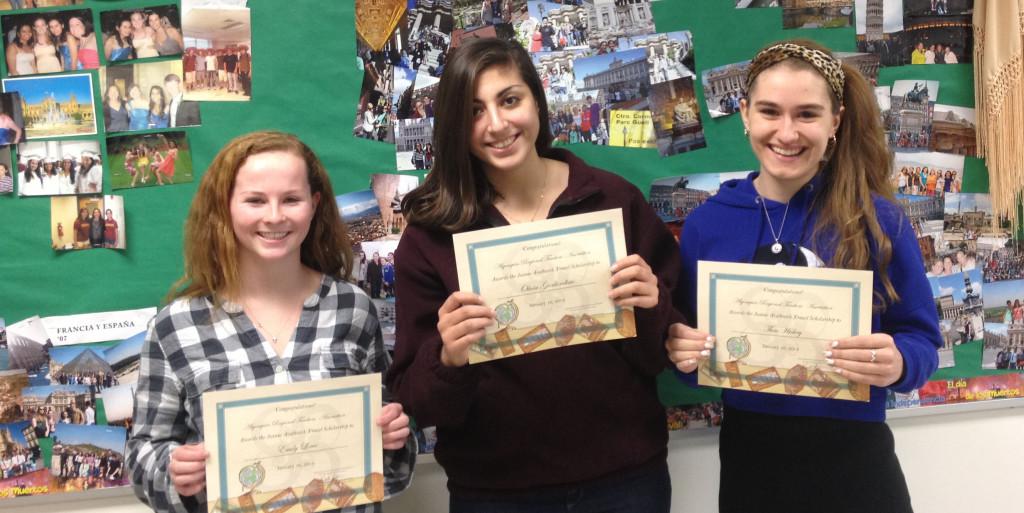 Emily Lowe, Olivia Giorlandino, and Thea Hickey pose with certificates in honor of their travel scholarships.
