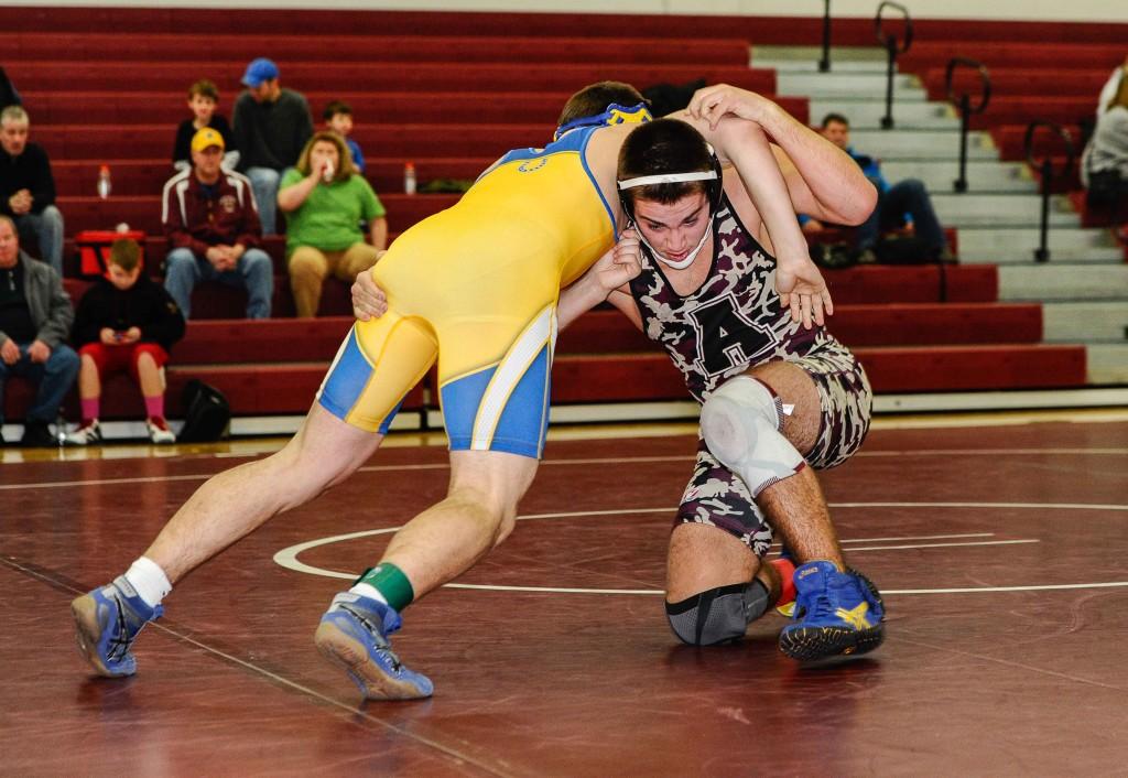 Junior David Wrin locks with an opponent on January 18.