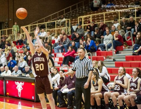 Senior Amanda Murphy shoots a basket, earning her 1000 career point.