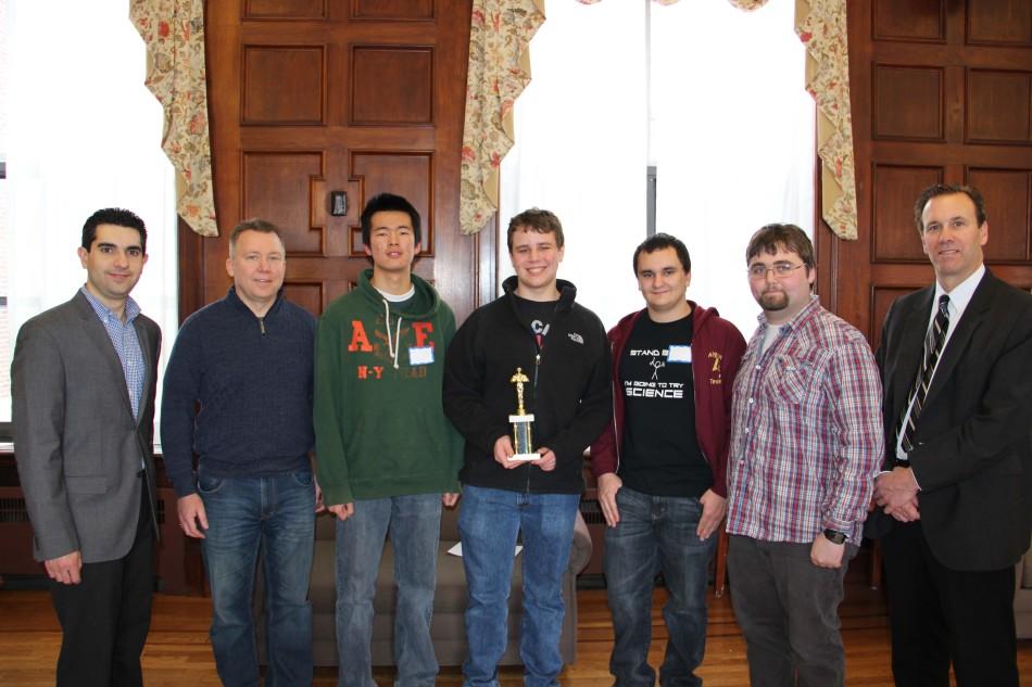From left to right: Dr. Adam Villa, Assistant Professor of Computer Science and Mathematics at PC; Dan Forhan, Advisor; Joey Wei, Eddie Pyne, Carl Bai, George Michas, and Charles Haberle, Assistant Vice President for Academic Affairs, Academic Facilities, and Technology Planning at PC. 
