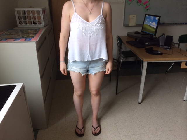 I wear cut off shorts and tank top with flip flops or Sperry’s…I like jean shorts and pretty flowy tank tops and band shirts are my favorite.
Nicole Gianetto, sophomore