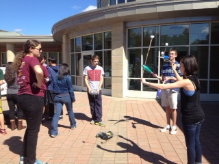 Juggling club members, senior Garrett Maglio and sophomore Tal Usvyatsky show robotics team members, seniors Sean ONeil  and Jessie Sigler how its done.