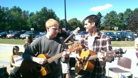 Senior, Nick DeFeudis and sophomore,  Nick Libby perform at the activity fair to encourage participation at Algonquin acoustics.