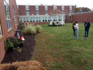 Students view the garden during the food day festival.