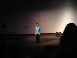 Sophomore Noah Brazer recites at the Poetry Out Loud semi-finals in the Black Box on January 15.