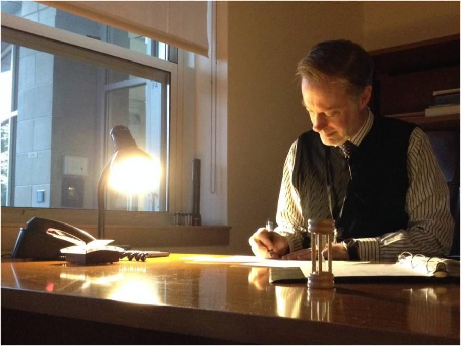 Principal Tom Mead sits at his desk next to the rotunda, catching up on his work. He displays a sort of extreme calm while at his desk, a refreshing feeling from the student buzz in the morning.  