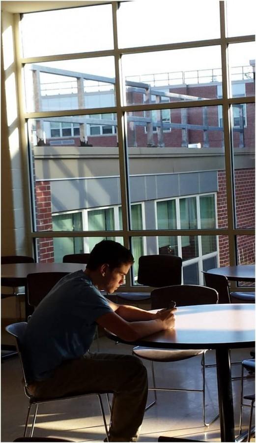 Junior Gavin Boyden sits in the cafeteria during his study period. 