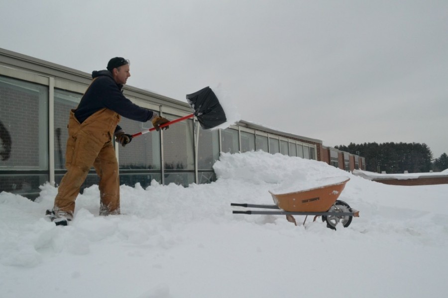 Head of maintenance Bud Richardson shovels snow off of the library’s roof on Thursday, February 12. Snow piles around Massachusetts grow as space to put the snow runs out.  According to the Washington Post, the average winter snowfall by this date in Worcester County is 40.6 inches. At the time of this photo, the county already had close to 92.1 inches of snow.