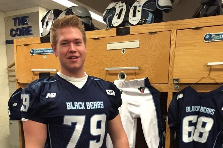 Senior+Trevor+Fuce+shows+off+his+new%2C+collegiate+football+jersey+at+the+University+of+Maine.+
