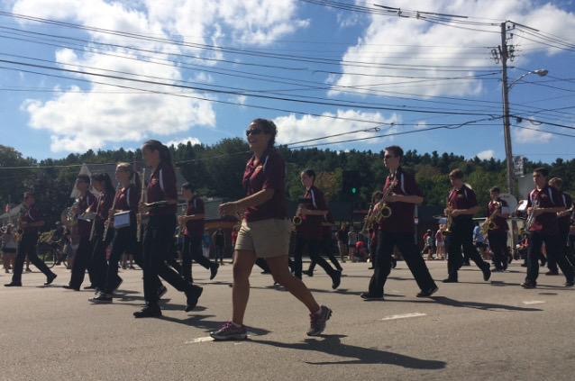 The Pepband march forward, leading the parade for Algonquin. 