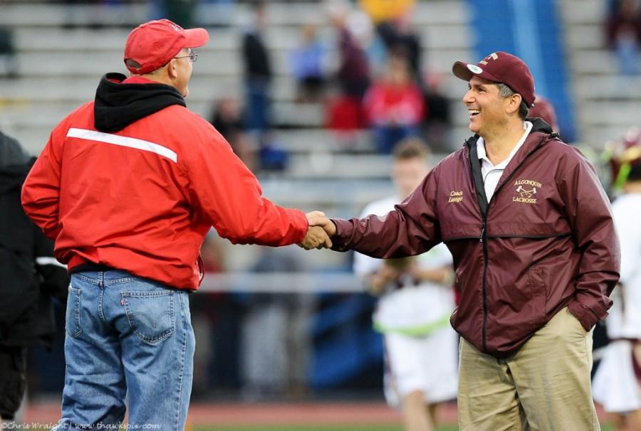 Varsity Coach Richard Luongo (right) shaking hands with Coach Terry Leary (left) from Saint John’s High School after a game. 
