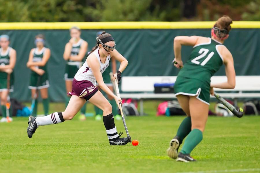 Senior captain Baelyn Duffy races with the ball to score a goal against Wachusett. 