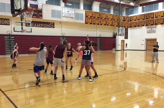 The girls basketball team scrimmages during a recent practice.