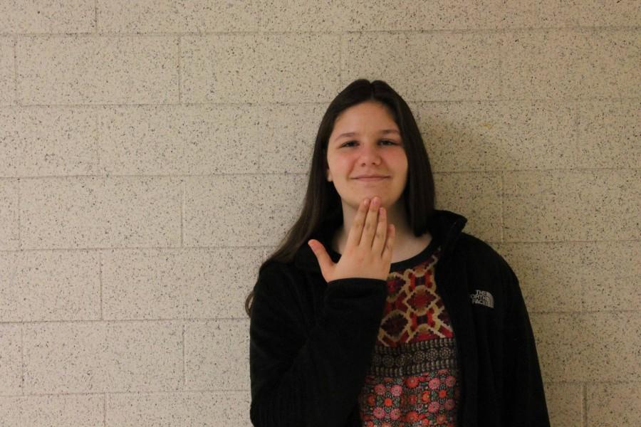 Sophomore+Samara+Patterson%2C+ASL+club+president+and+founder%2C+signs+thank+you+in+American+Sign+Language.