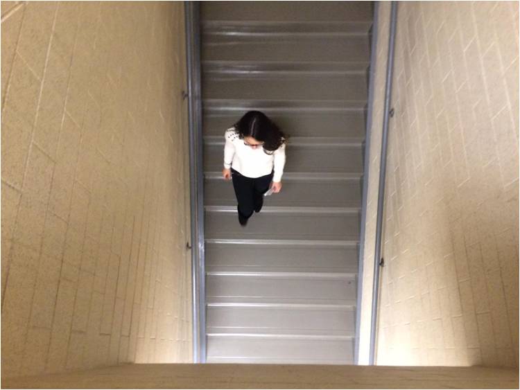 Freshman Larissa Andrade walks down the h300 staircase to class.
