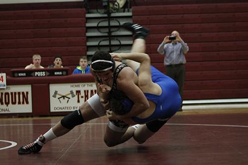 Junior Colin Robinson takes down his Leominster opponent with a team win of 52-20 on January 13. 