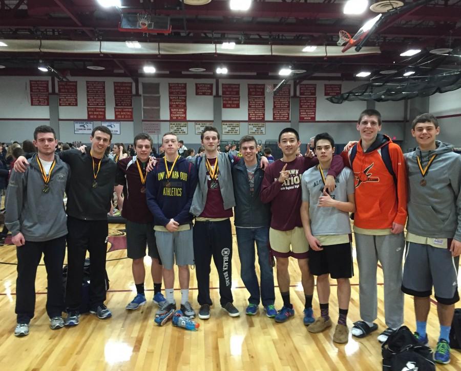 After winning the boys indoor track Midland-Wachusett A league title, seniors pose with their medals on Saturday January 30 at Fitchburg High School.