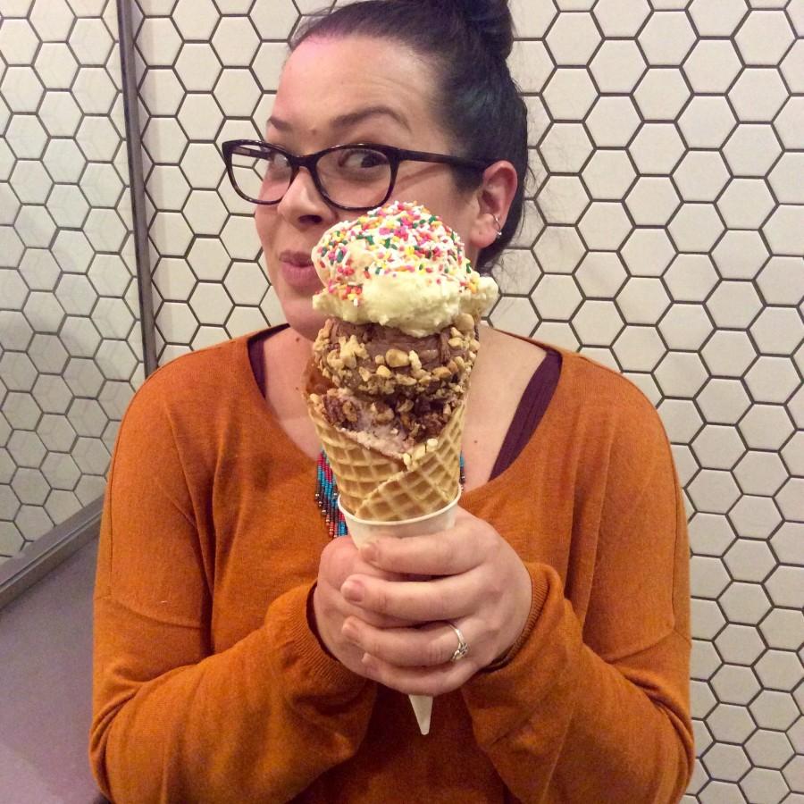 A customer enjoys hefty scoops of ice cream at the Microcreamery.
