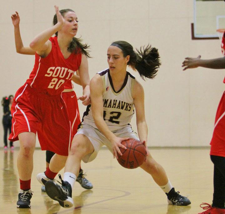 Senior captain Caroline Leonard drives to the hoop against Worcester South on March 1.