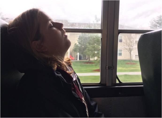 After a tiring day at school, senior Annie Campbell is “resting her eyes” on the way to a lacrosse game against North Middlesex, where Algonquin won 15-7.