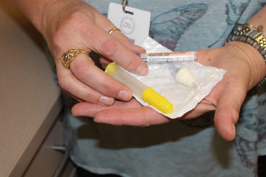 School nurse, Justine Fishman, demonstrates the Narcan injection. 