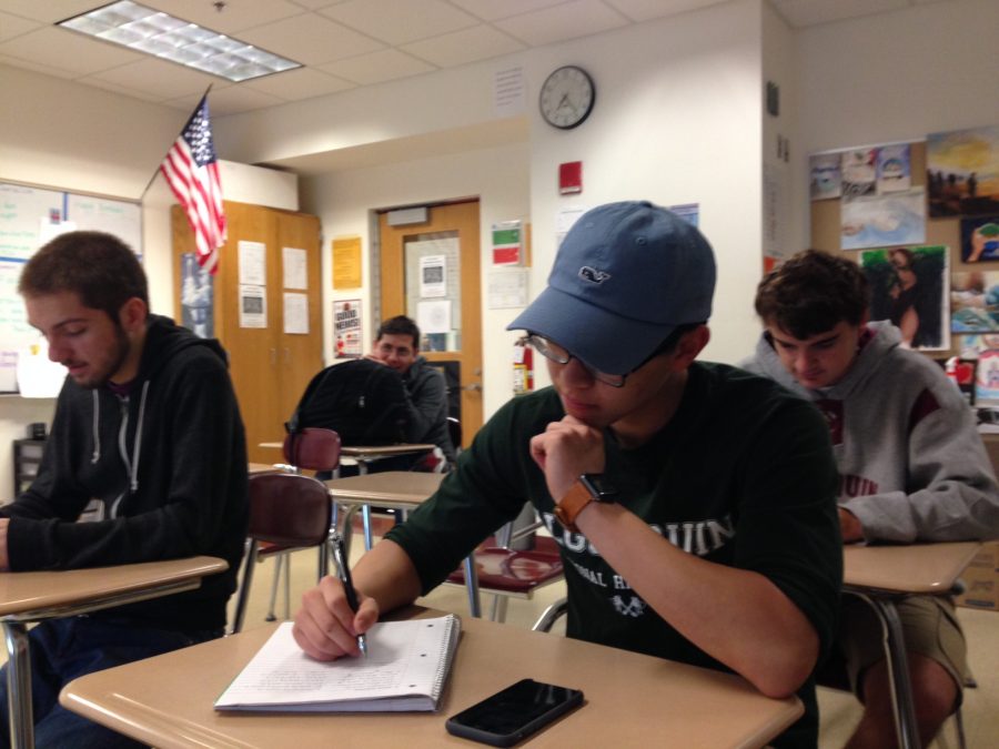 Seniors Nick Hills, Christian Fonceca, George Gu, and Daniel Grist  in homeroom H211 work on homework, relax, and use their phones before the regular school day begins. 
