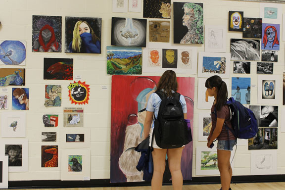 Students study masterpieces created in art classes of all different levels.