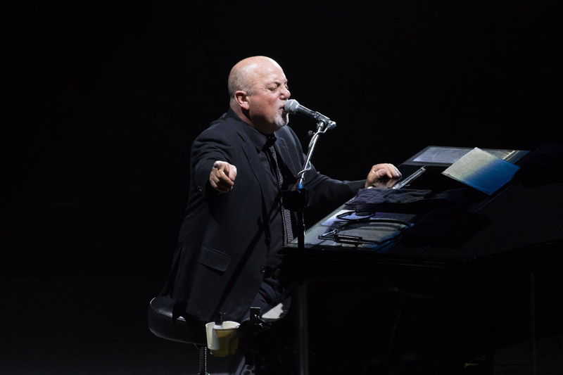 Billy Joel performs at his piano in a legendary Madison Square Garden show.