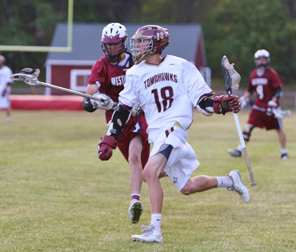 Freshman Ric Carreras runs the ball up the field in a game against Westborough on May 27.