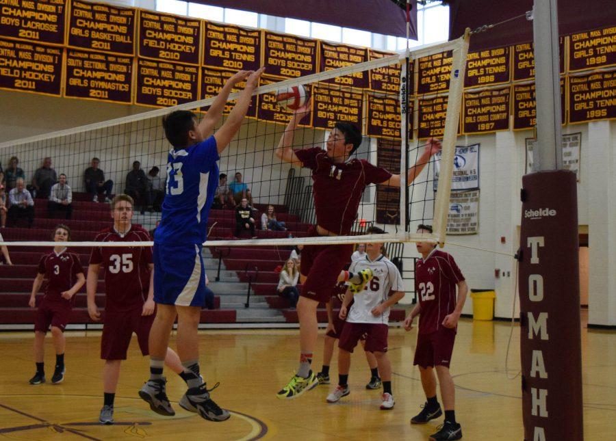 Sophomore Alex Chen (11) attacks the ball against Leominster on May 13.