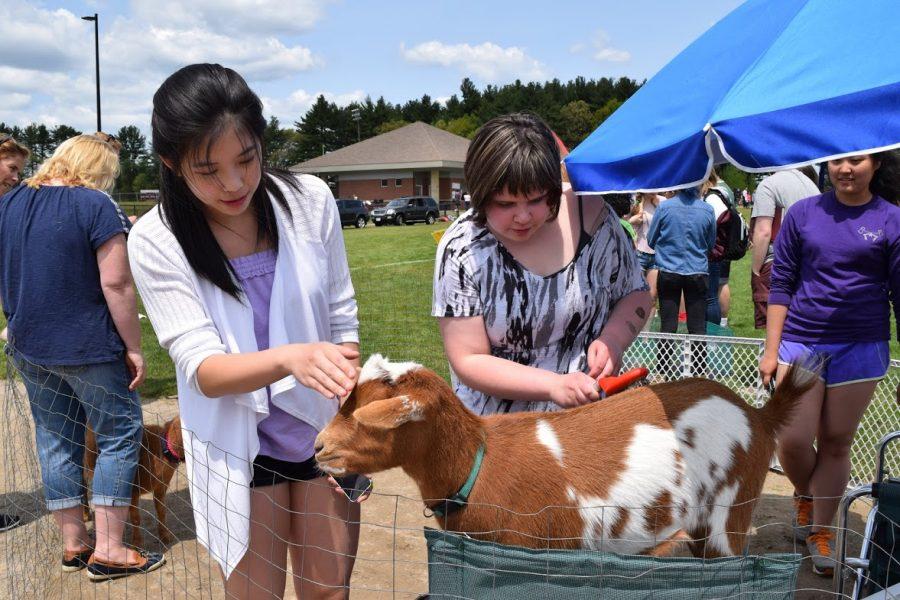 Two students participate in the Hosa sponsored petting zoo.