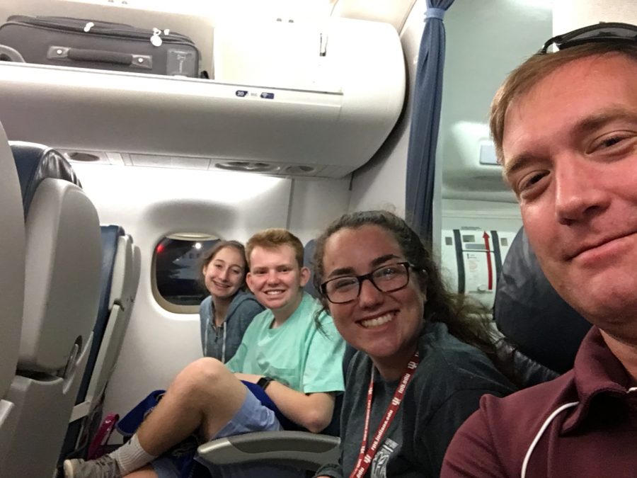 Advisor Kevin Hausmann takes a selfie with club leaders Kate Crimmings, Ryan Strobel, and Isabella Masciarelli on their way to the Leadership Conference.