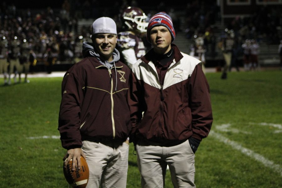 Seniors Kevin Hatton and Kevin OLeary take a break from their managing duties to pose for a picture on the side line during the home game against St. Johns on October 28.