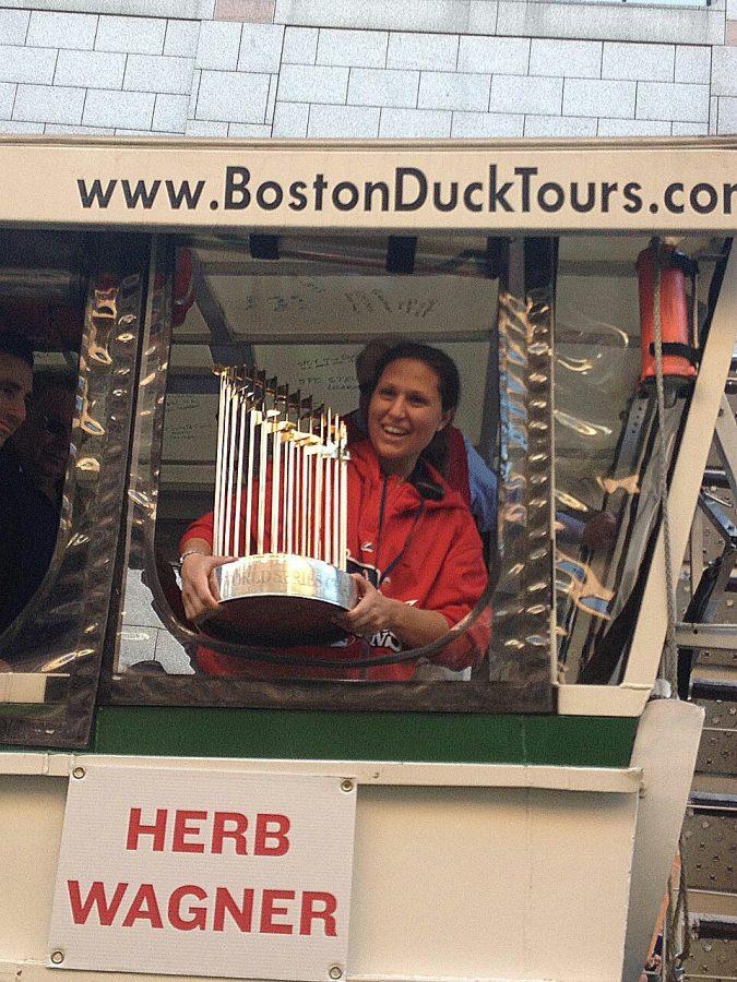 Gym+teacher+Melissa+Fustino+experiences+many+events+at+Fenway%2C+including+the+2013+World+Series+Parade.+Her+work+as+a+security+guard+paid+off+as+she+held+the+trophy+in+the+Boston+Duck+Tour+truck+among+Red+Sox+team+members.