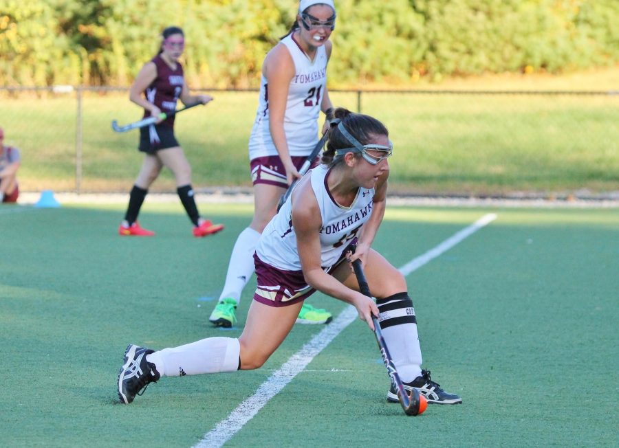 Captain Grace Antino winds up for a powerful shot in a game against Groton Dunstable on October 19, which resulted in a 5-0 win.