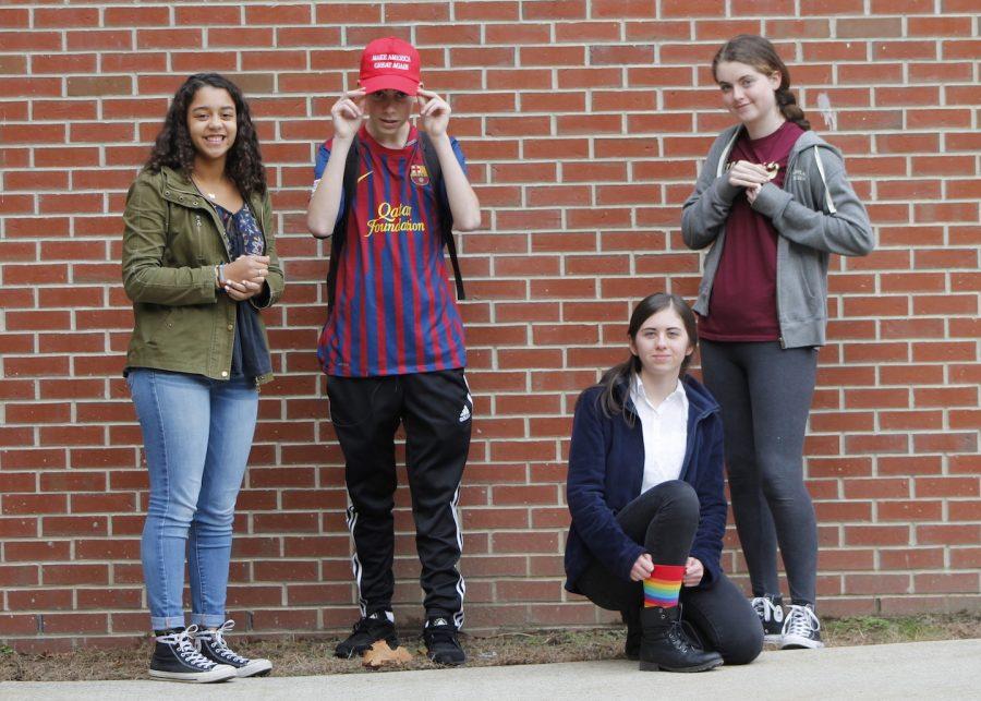Junior Sophie Hopkins, sophomore Carter Rawstron, junior Taylor Murphy, and sophomore Nicole Clark share varying political views but have all expressed their opinions through their choice of attire. 