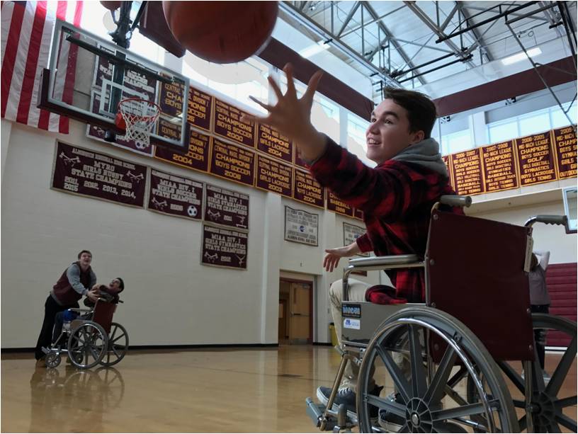 As part of the junior gym curriculum, junior Will Hanlon takes part in the unified basketball unit.