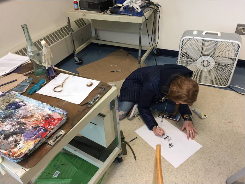 Senior Elise Ribaudo comfortably draws during George Hancin’s fourth period art class.