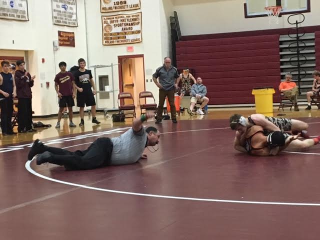 Senior captain Drew Cozzolino pins down an opponent in a match against Marlborough on January 4. Algonquin won  42-27.