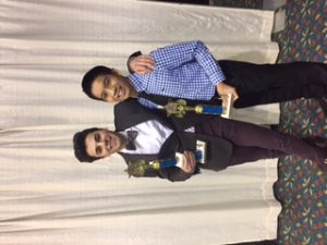 Juniors Jake DeMarco and Jason Nguyen pose with their first and third place trophies, respectively, in the Apparel and Accessories Marketing category.