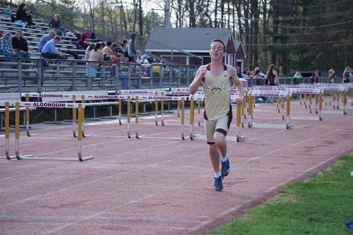 Junior Andrew Michalik sprints  towards the finish line, hoping to win first place.