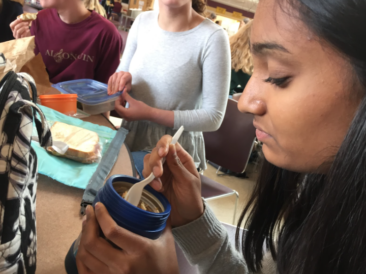 Freshman Ashna Jain takes in the smells as she enjoys her lunch.