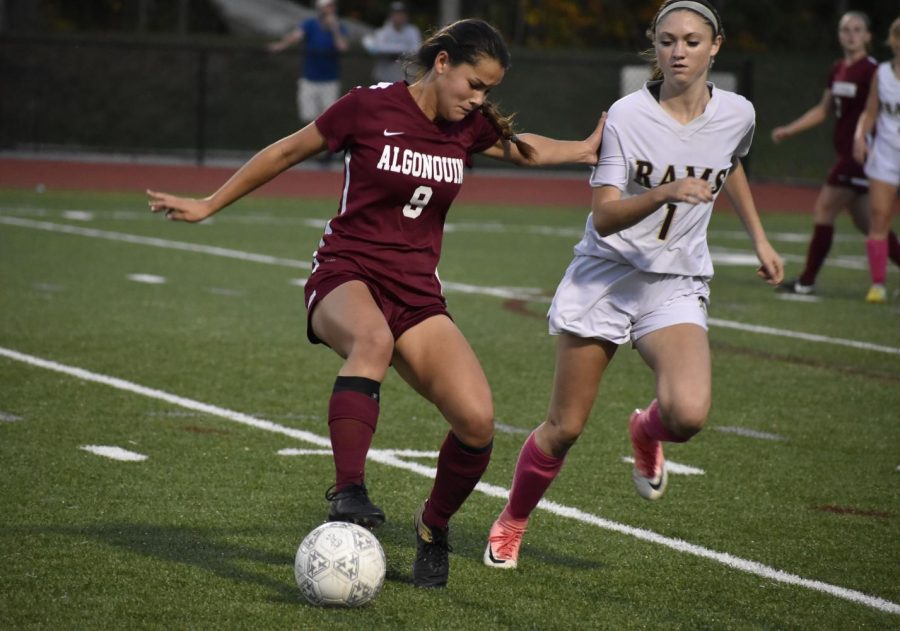 Junior Jacqui Moy controls the ball at Shepherd Hill on  October 10. 