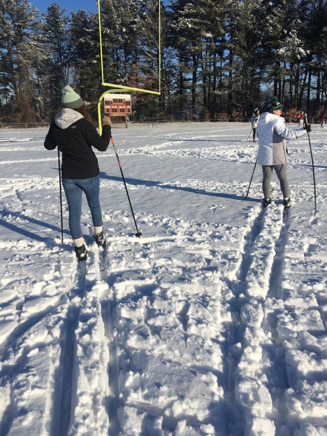 A gym class tries cross-country skiing for the first time in the new snow. Senior Mallory Daoust and junior Hailey Lowe enjoy the final minutes before heading in.