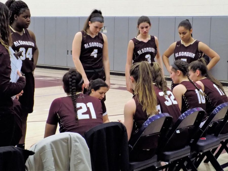 Coach Mel Fustino gives a pep talk as the team gets ready to get back into the game against Westborough on February 19. The team played hard for the win, with the final score being 63-51.