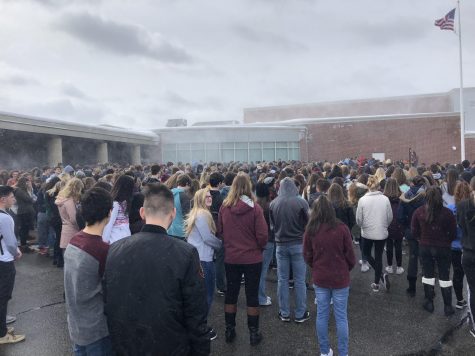 Students stand in solidarity amid the flurry of snow.