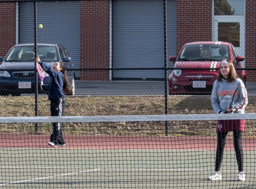 Freshman Emily Wu serves the ball in a match against Hopedale.