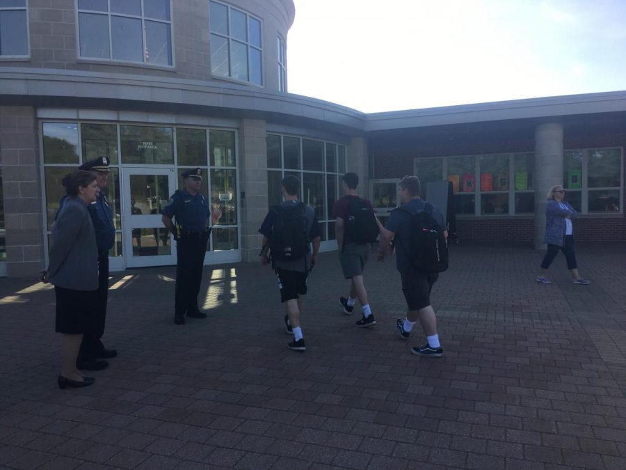 Northborough chief of police William Lyver Jr, Detective Sergeant Brian Griffin and superintendent Christine Johnson stand outside of the rotunda on the morning of May 31 in response to the note threatening a shooting at the high school. 