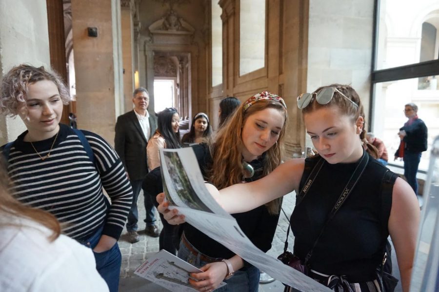 Juniors Lauren Earley and Annalise Loizeaux gaze at the map of the Louvre, one of the largest museums in the world, which is home to Leonardo da Vinci’s Mona Lisa.