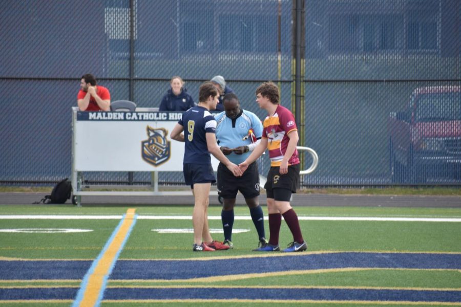 As the teams warm up, senior and co-captain Ben Spellman meets with the Malden Catholic capitan and the referee.
 “When I started as a freshman, I didn’t think I was going to get anywhere,” Spellman said, “I barely knew how to run with the ball. Now here I am as a captain scoring tries.” 
